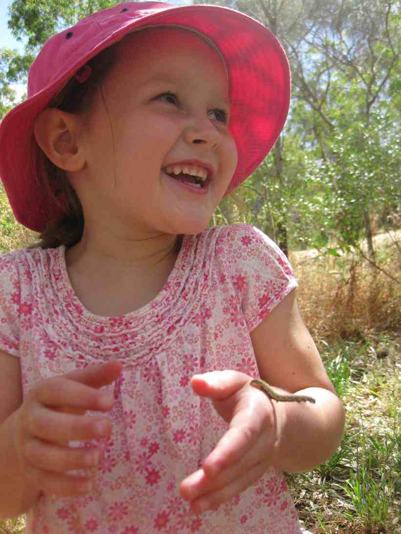 Children playing with caterpillars 